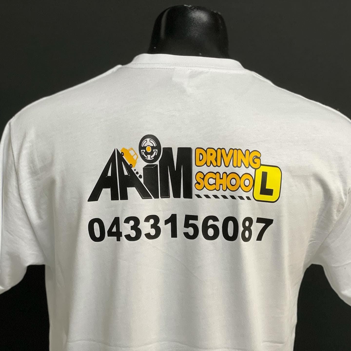 AIM Driving School: custom branded shirts by South West Apparel