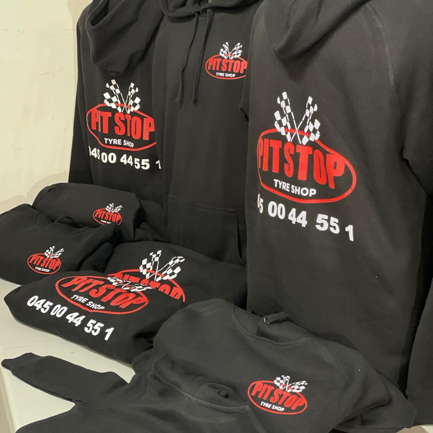 Pit Stop Tyre Shop hoodies with the workshop logo on the chest